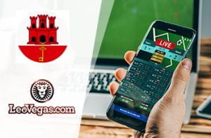 Il logo del bookmaker LeoVegas, l’emblema di Gibilterra, uno smaartphone collegato ad un sito di scommesse