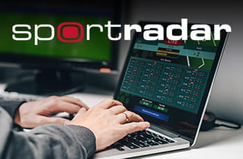 Il logo di Sportradar e un laptop