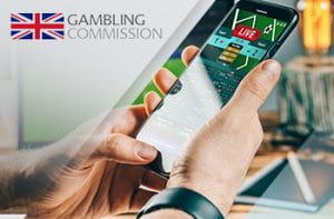 Il logo della UKGC e uno smartphone collegato a un sito scommesse online