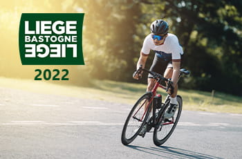 Ciclista su strada, logo Liegi Bastogne Liegi 2022